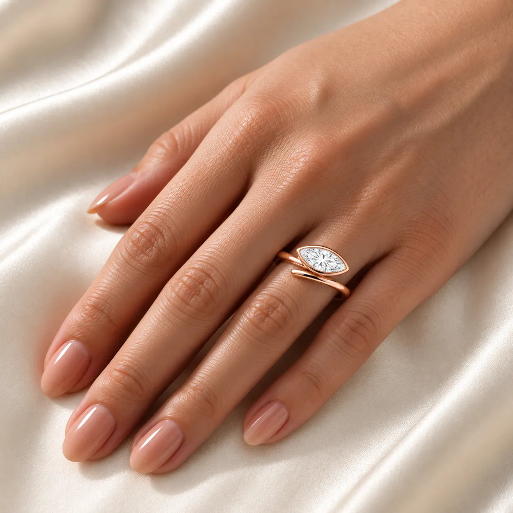 Elegant Pear-Cut Bezel Wrap Diamond Ring
