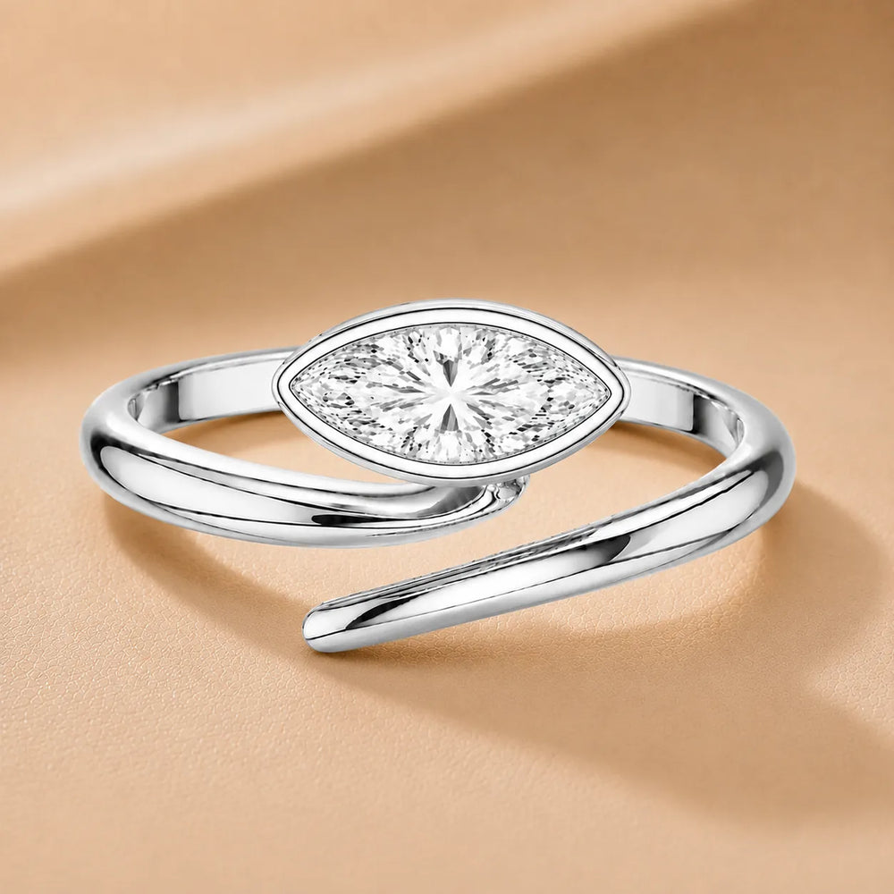 Elegant Pear-Cut Bezel Wrap Diamond Ring