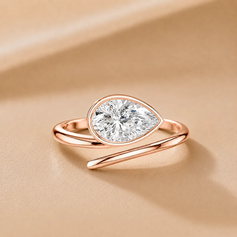 Elegant Pear-Cut Bezel Wrap Diamond Ring