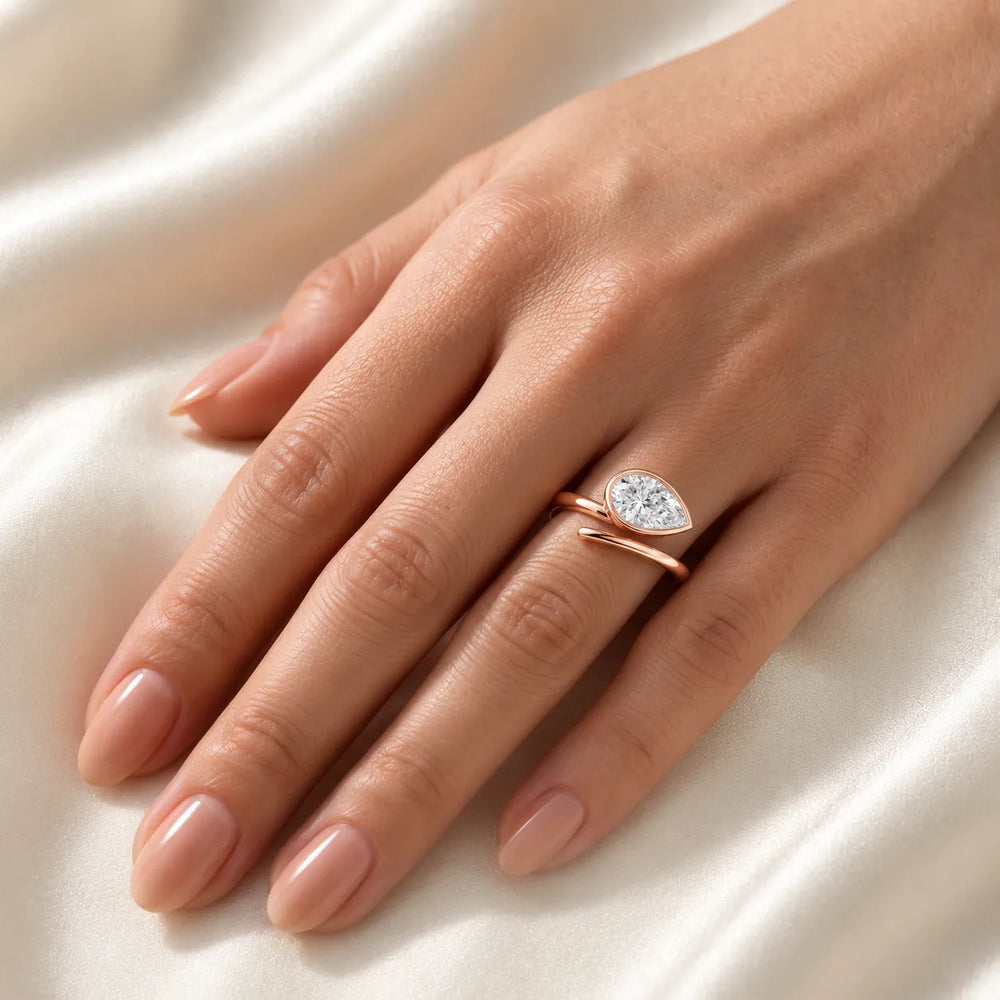 Elegant Pear-Cut Bezel Wrap Diamond Ring