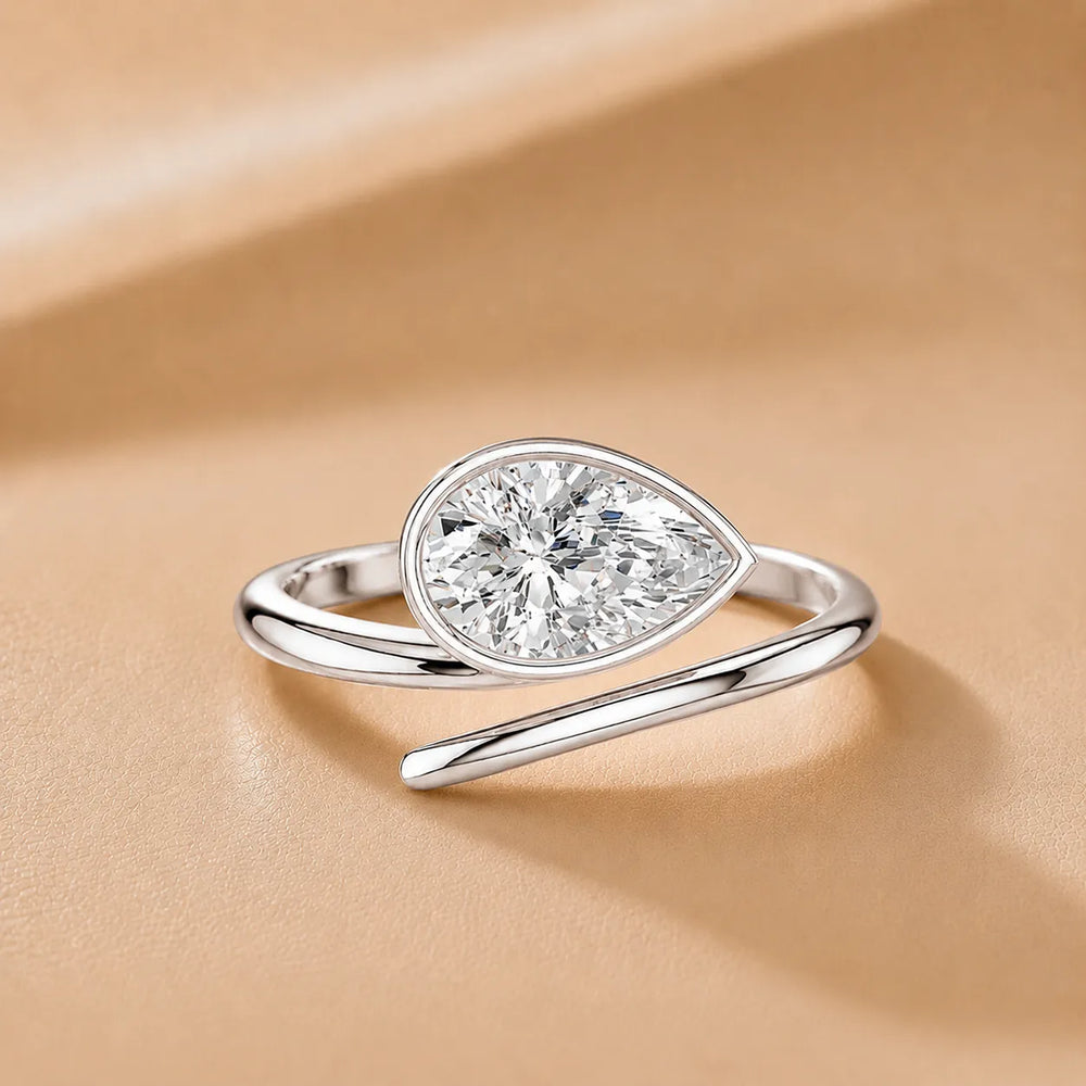 Elegant Pear-Cut Bezel Wrap Diamond Ring