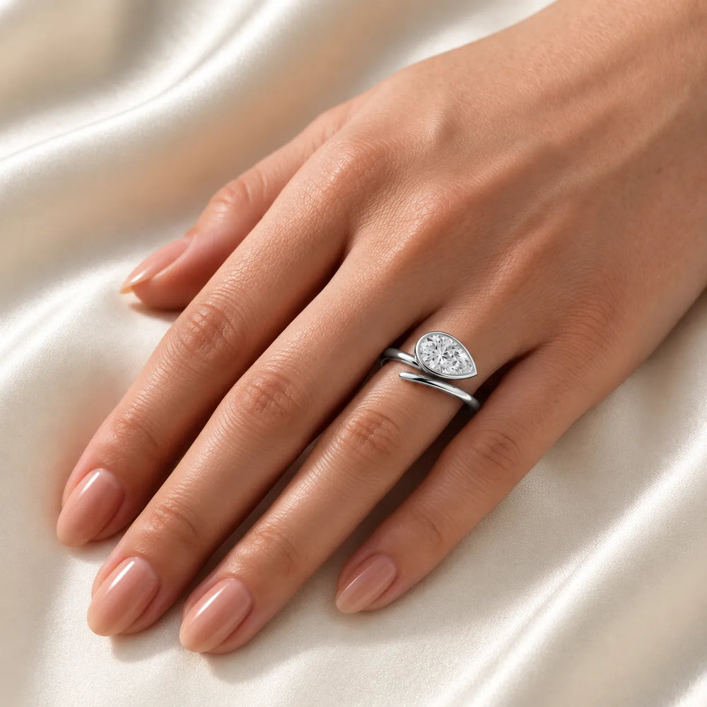 Elegant Pear-Cut Bezel Wrap Diamond Ring
