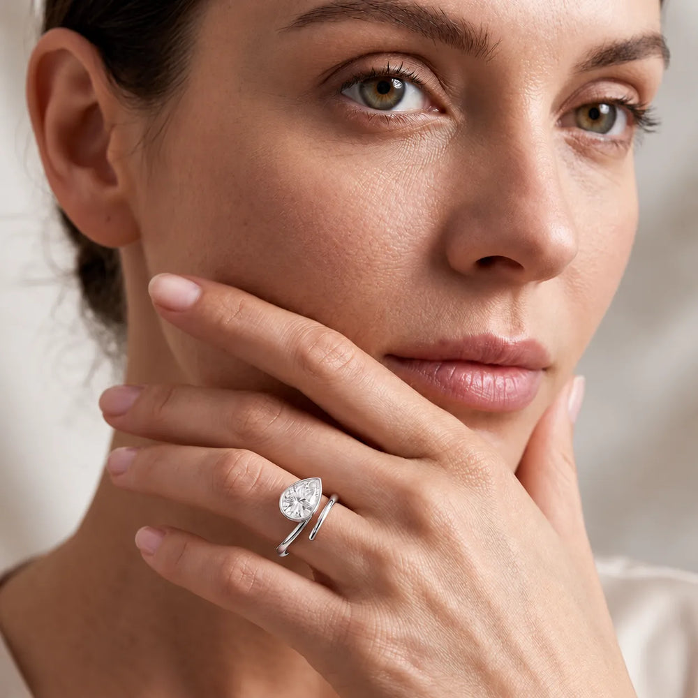 Elegant Pear-Cut Bezel Wrap Diamond Ring