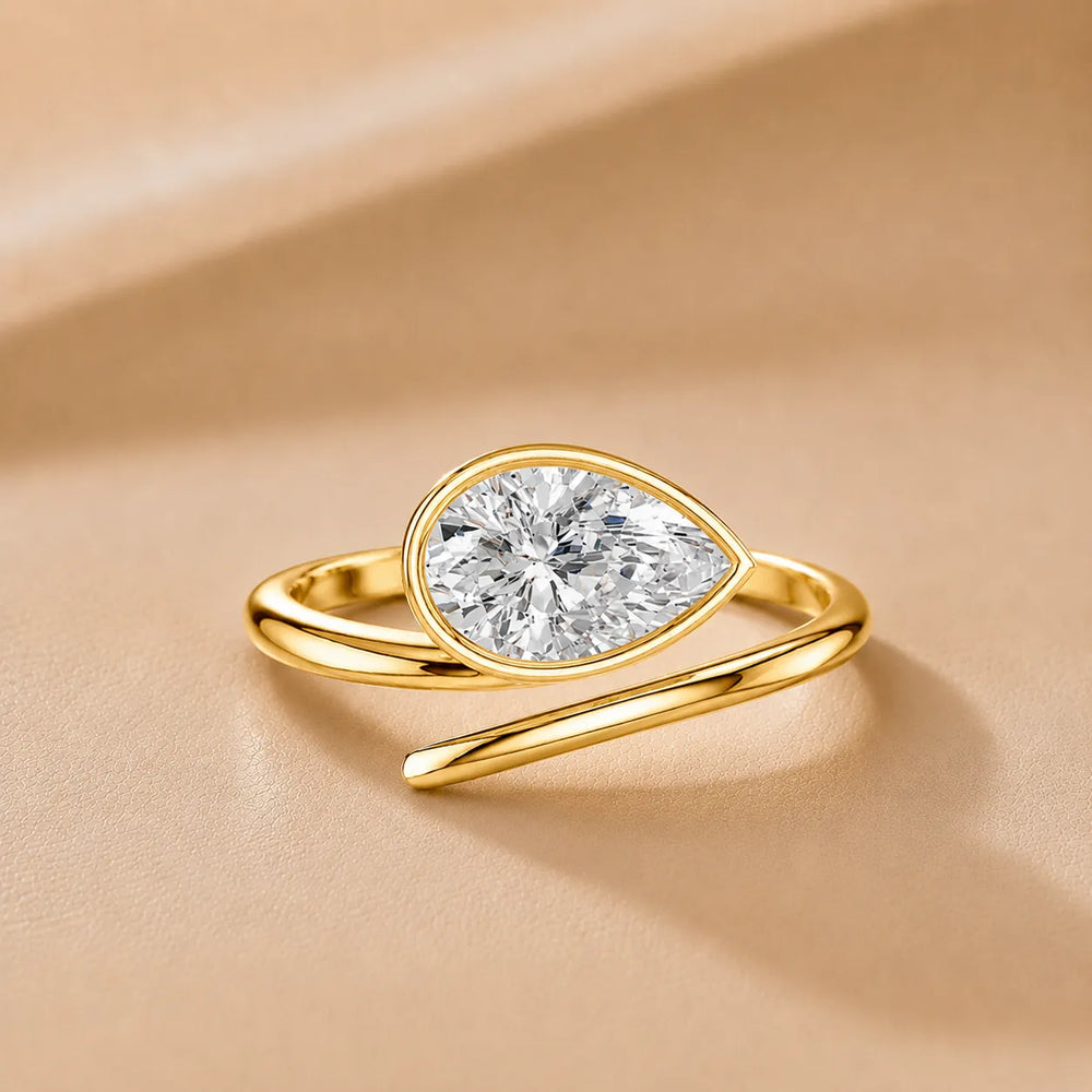 Elegant Pear-Cut Bezel Wrap Diamond Ring