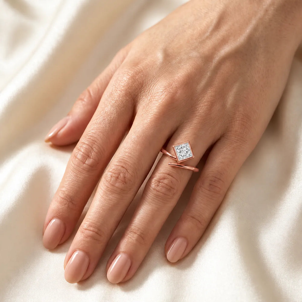 Elegant Pear-Cut Bezel Wrap Diamond Ring