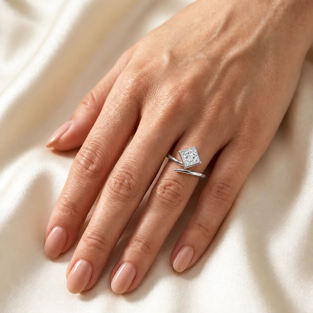 Elegant Pear-Cut Bezel Wrap Diamond Ring