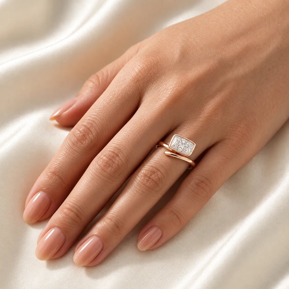 Elegant Pear-Cut Bezel Wrap Diamond Ring