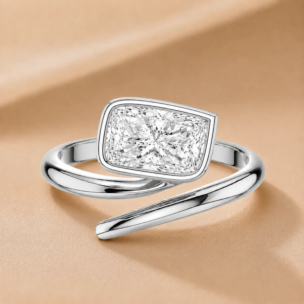 Elegant Pear-Cut Bezel Wrap Diamond Ring