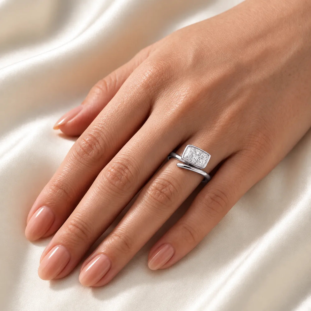 Elegant Pear-Cut Bezel Wrap Diamond Ring