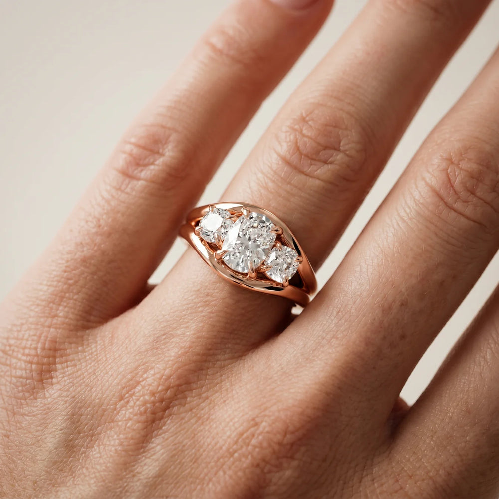 Exquisite Three-Stone Oval Diamond Engagement Ring