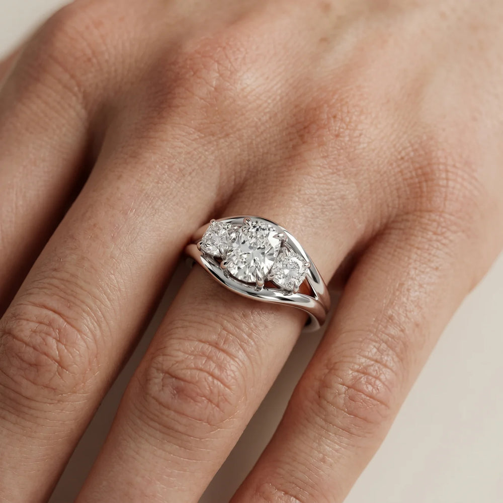 Exquisite Three-Stone Oval Diamond Engagement Ring