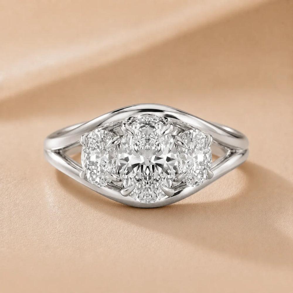 Exquisite Three-Stone Oval Diamond Engagement Ring