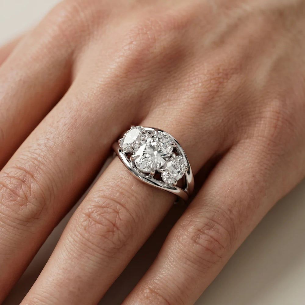 Exquisite Three-Stone Oval Diamond Engagement Ring