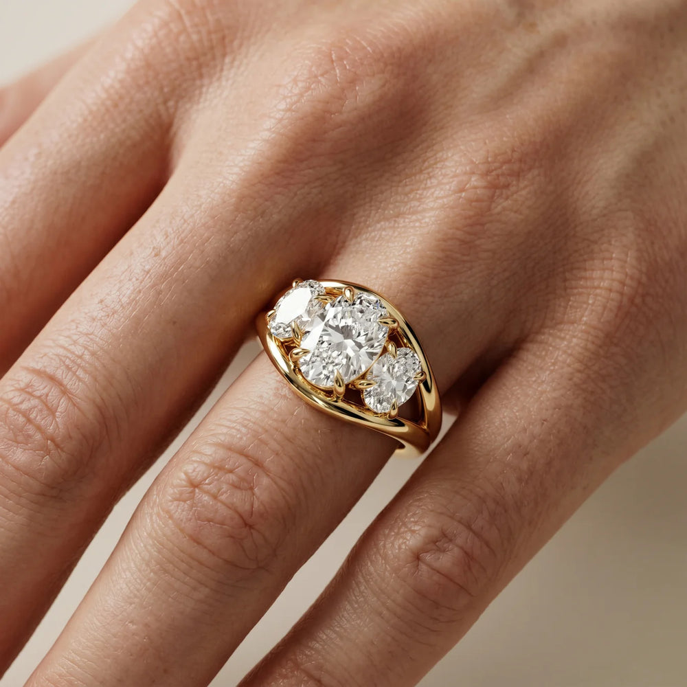 Exquisite Three-Stone Oval Diamond Engagement Ring