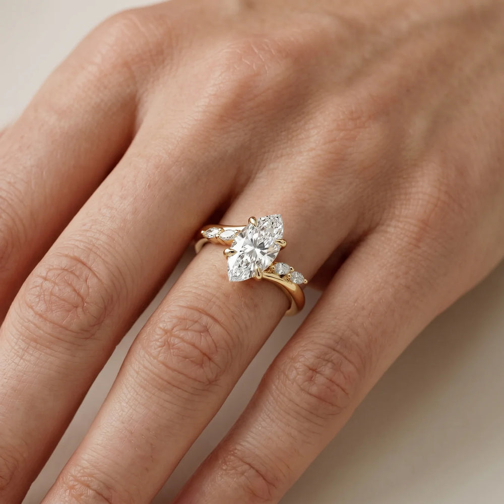 Flora Twist Side Stone Oval Diamond Engagement Ring