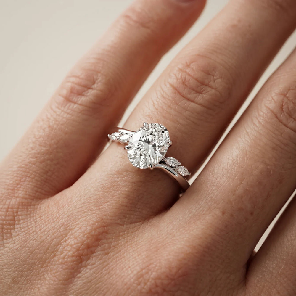 Flora Twist Side Stone Oval Diamond Engagement Ring