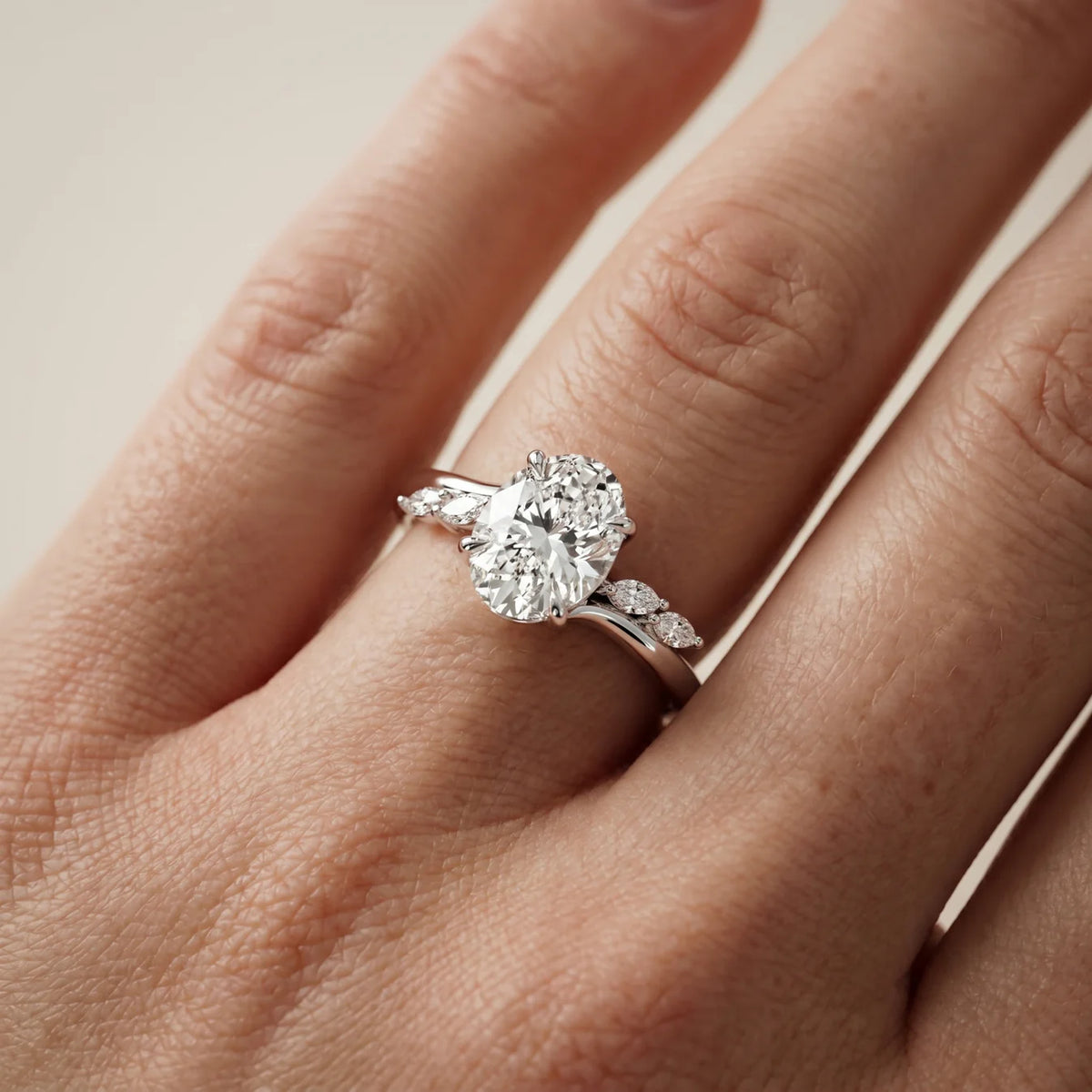 Flora Twist Side Stone Oval Diamond Engagement Ring