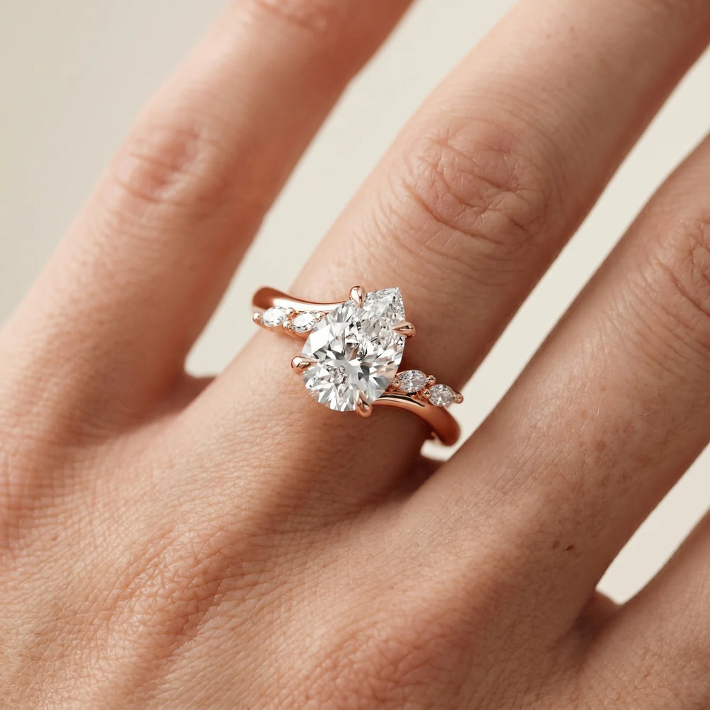 Flora Twist Side Stone Oval Diamond Engagement Ring