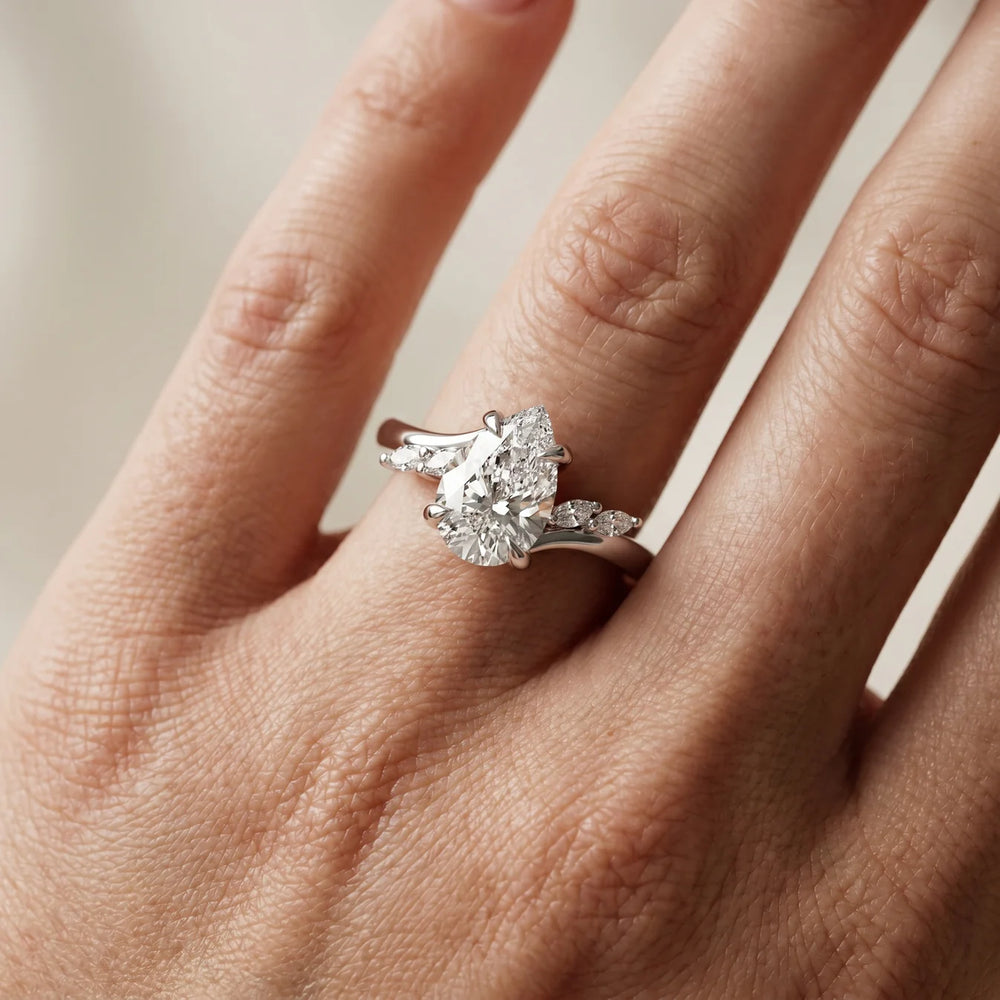 Flora Twist Side Stone Oval Diamond Engagement Ring