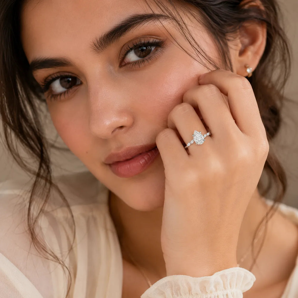 Flora Twist Side Stone Oval Diamond Engagement Ring