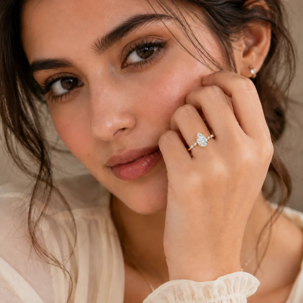 Flora Twist Side Stone Oval Diamond Engagement Ring