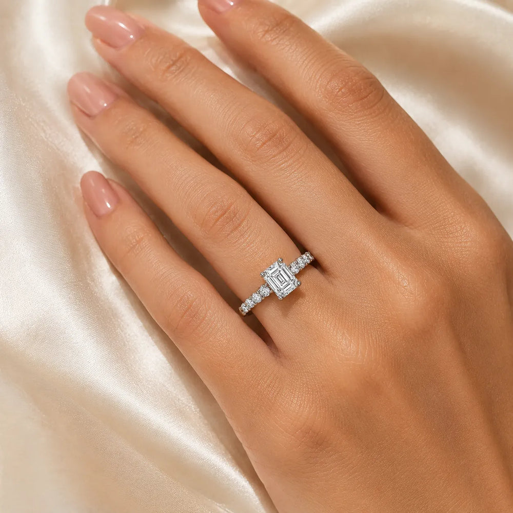 Elegant Solitaire Ring with Graduated Accent Stones