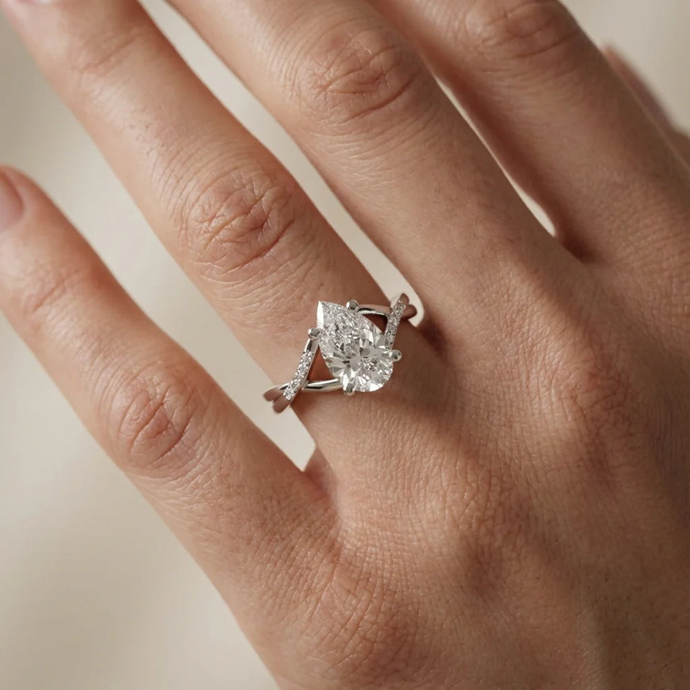 Veronica Twist Side Stone Oval Diamond Engagement Ring