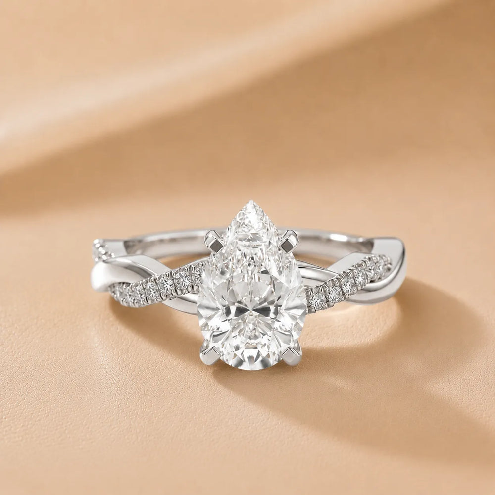 Twisted Side Stone Round Diamond Engagement Ring
