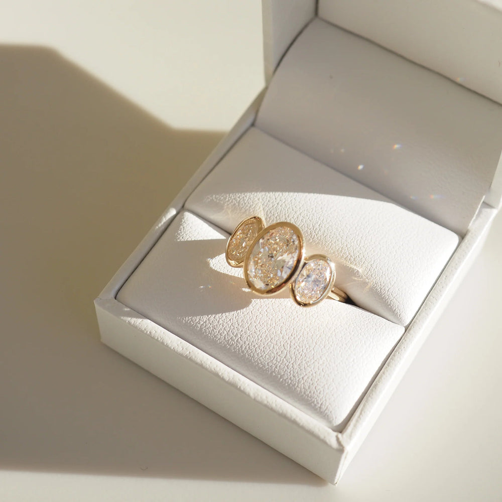 Bezel Set Three Stone Oval Cut Labgrown Engagement Ring