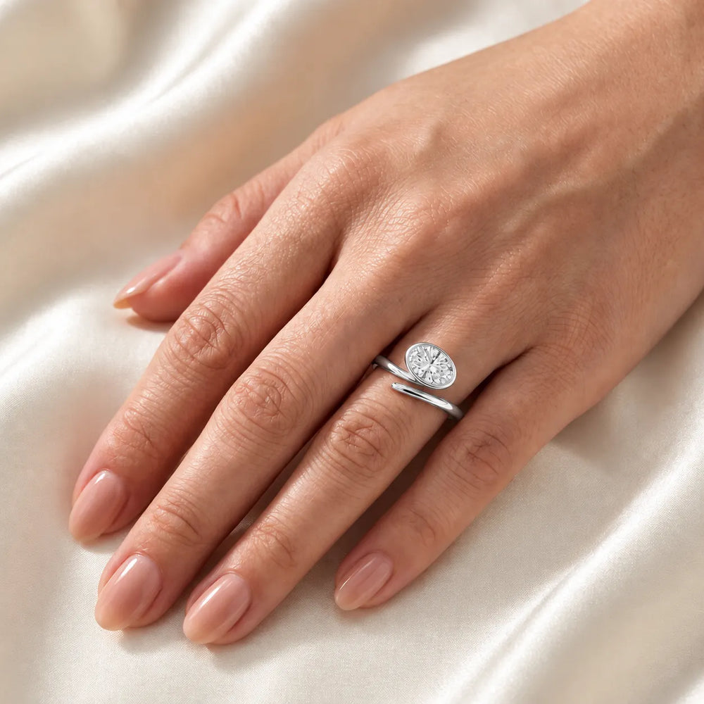 Elegant Pear-Cut Bezel Wrap Diamond Ring