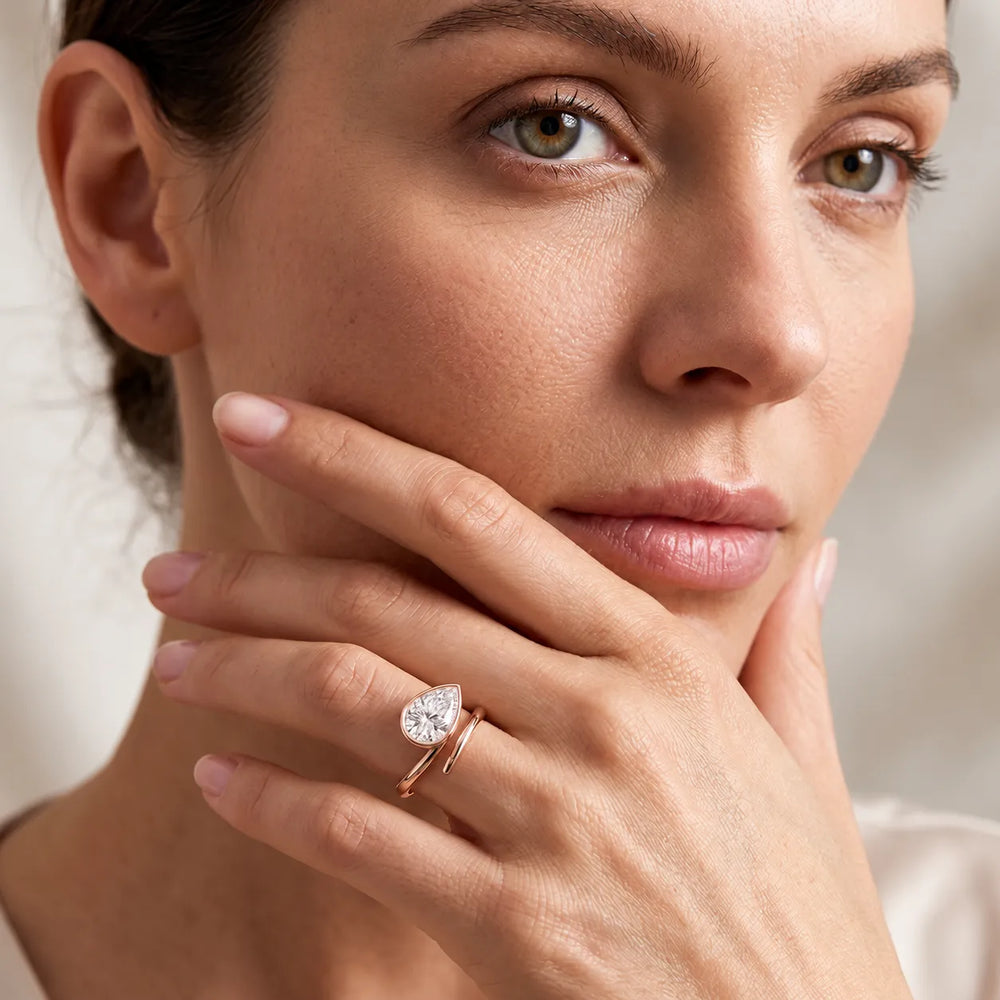 Elegant Pear-Cut Bezel Wrap Diamond Ring