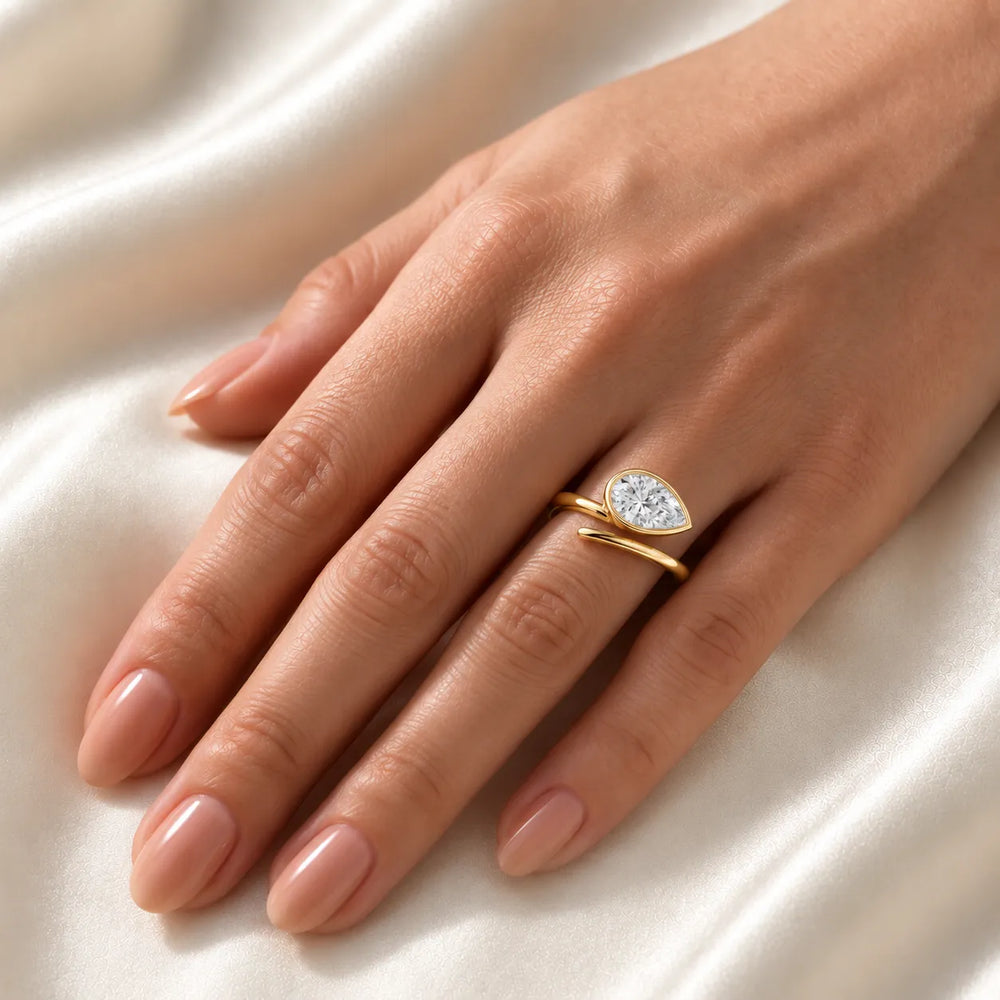 Elegant Pear-Cut Bezel Wrap Diamond Ring