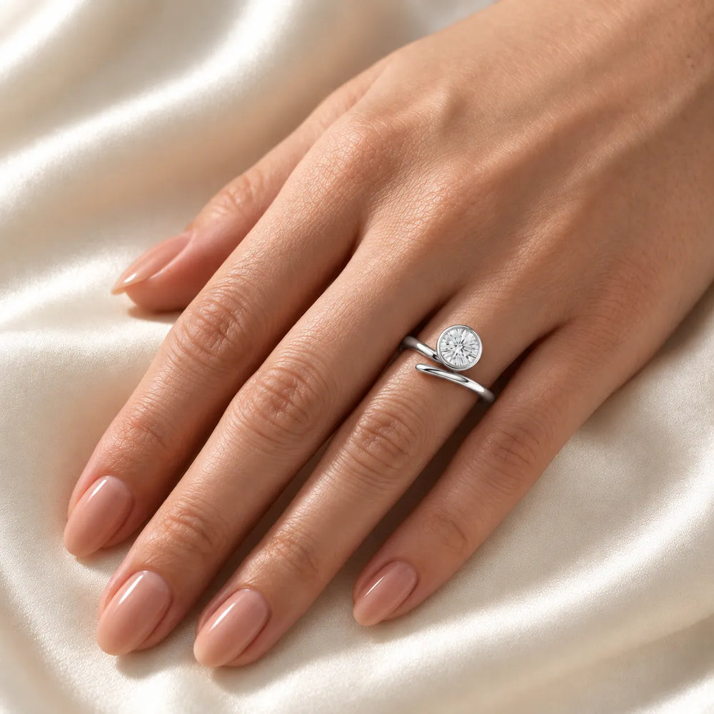 Elegant Pear-Cut Bezel Wrap Diamond Ring