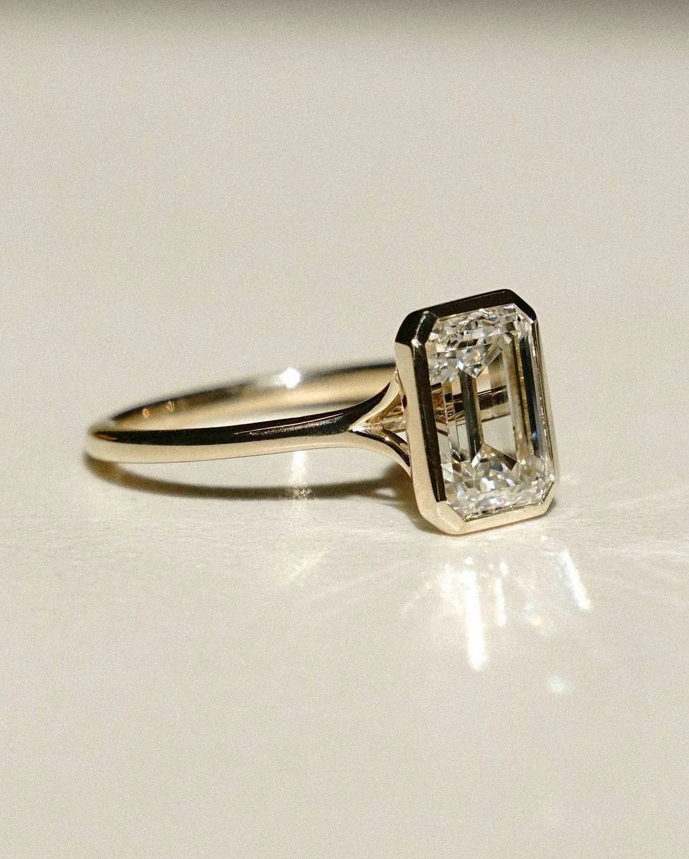 Bezel Set 2.60 Ct Emerald Cut Lab Grown Diamond Engagement Ring | IGI Certified