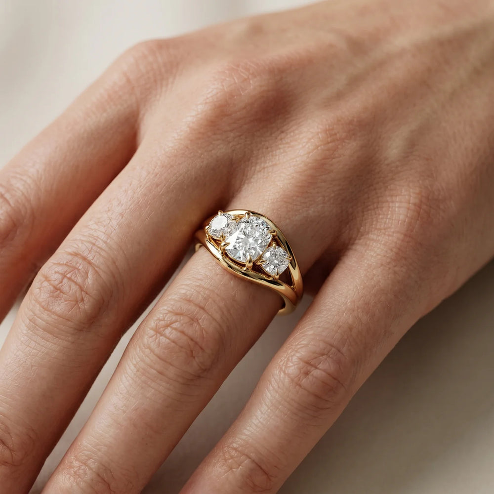 Exquisite Three-Stone Oval Diamond Engagement Ring