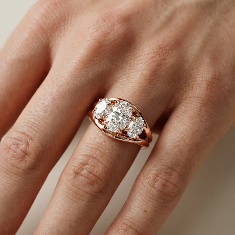 Exquisite Three-Stone Oval Diamond Engagement Ring