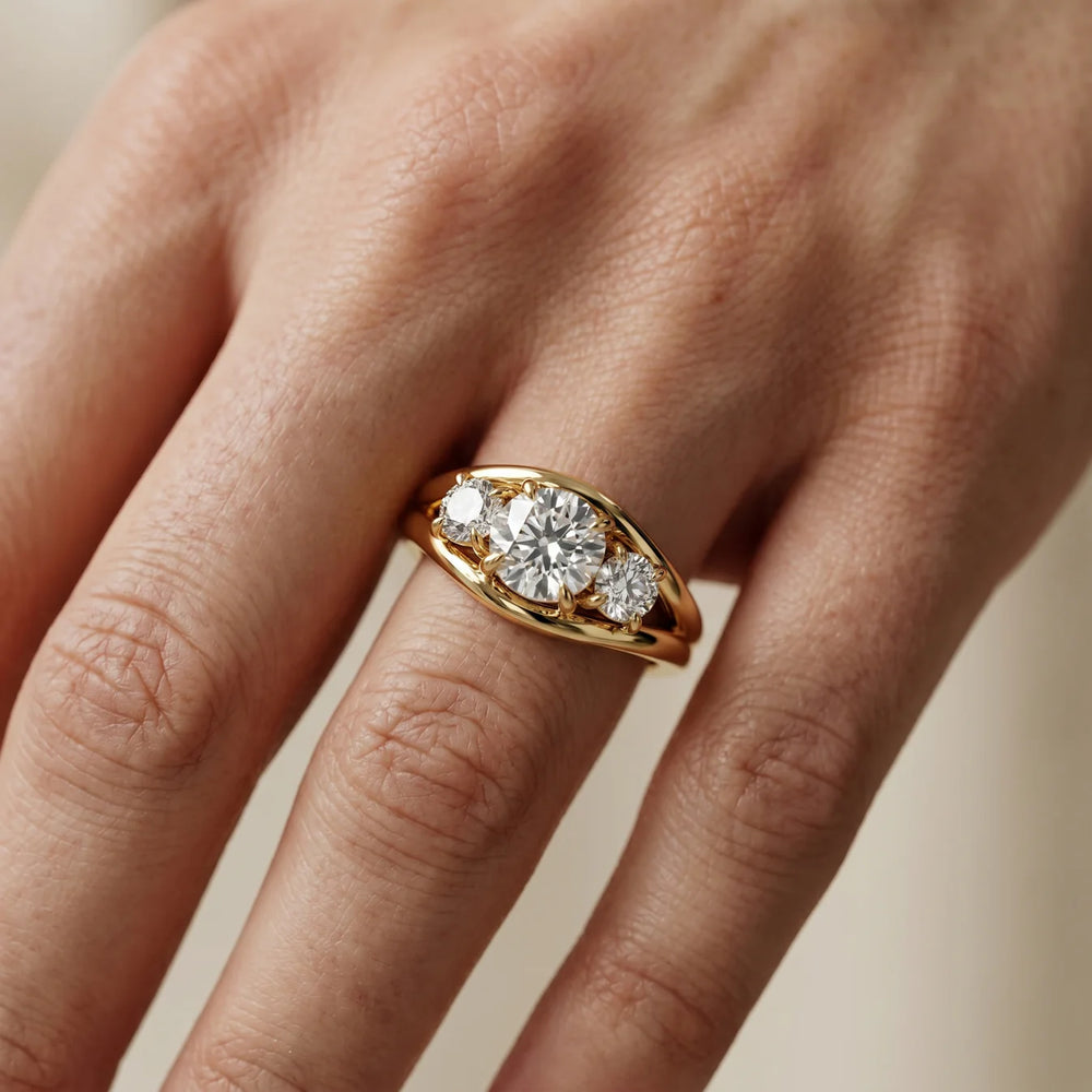 Exquisite Three-Stone Oval Diamond Engagement Ring