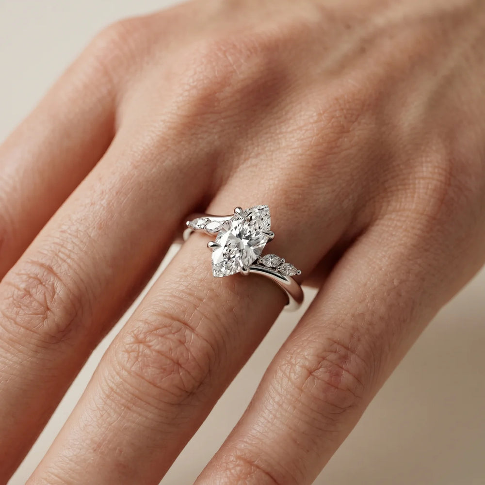 Flora Twist Side Stone Oval Diamond Engagement Ring