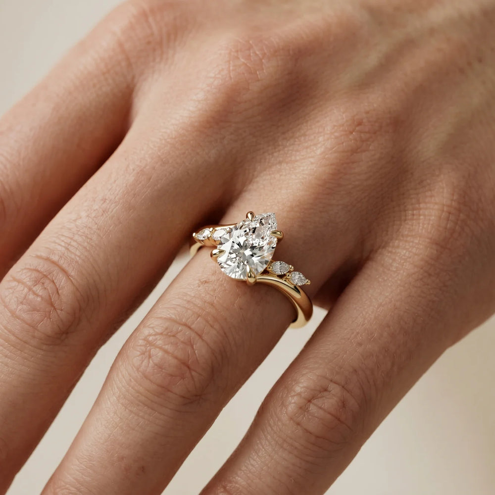 Flora Twist Side Stone Oval Diamond Engagement Ring