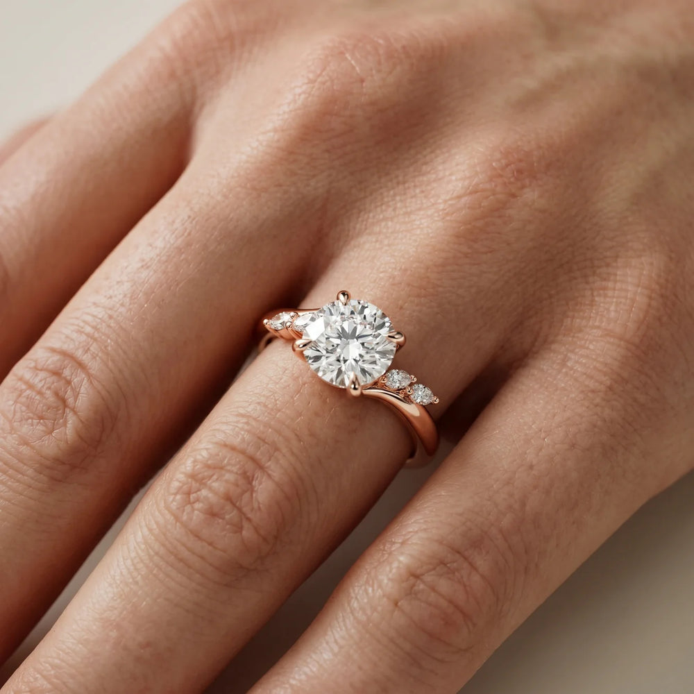 Flora Twist Side Stone Oval Diamond Engagement Ring
