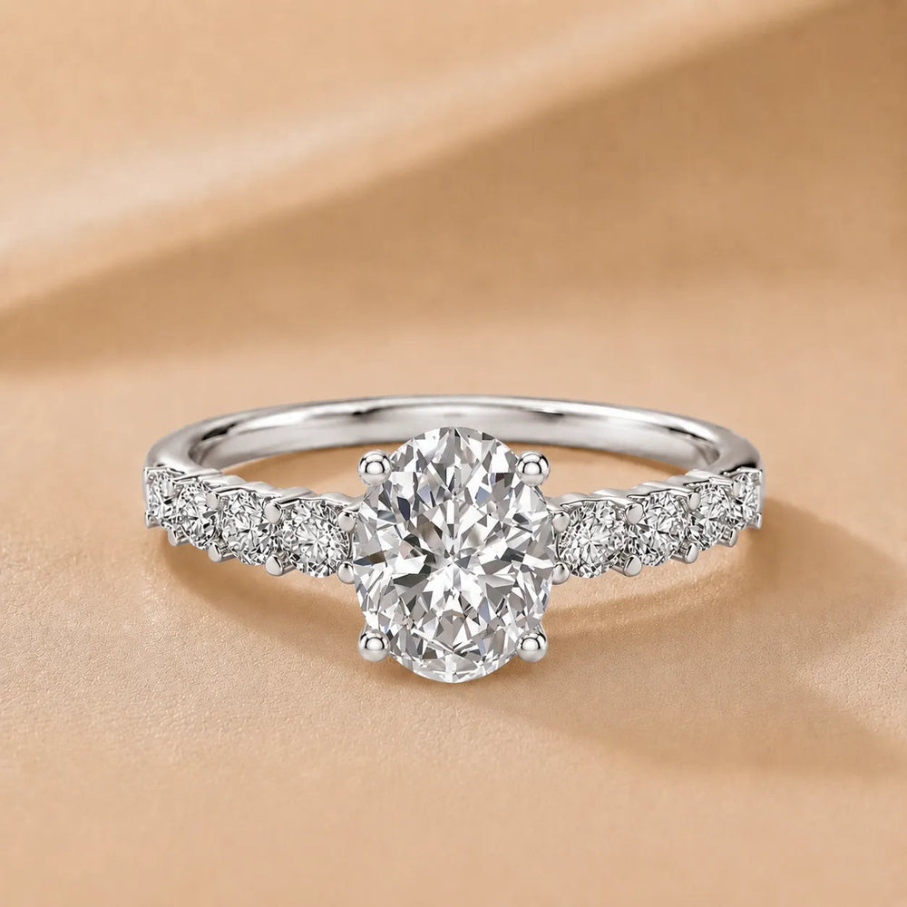 Elegant Solitaire Ring with Graduated Accent Stones – Oval (925 Sterling Silver)