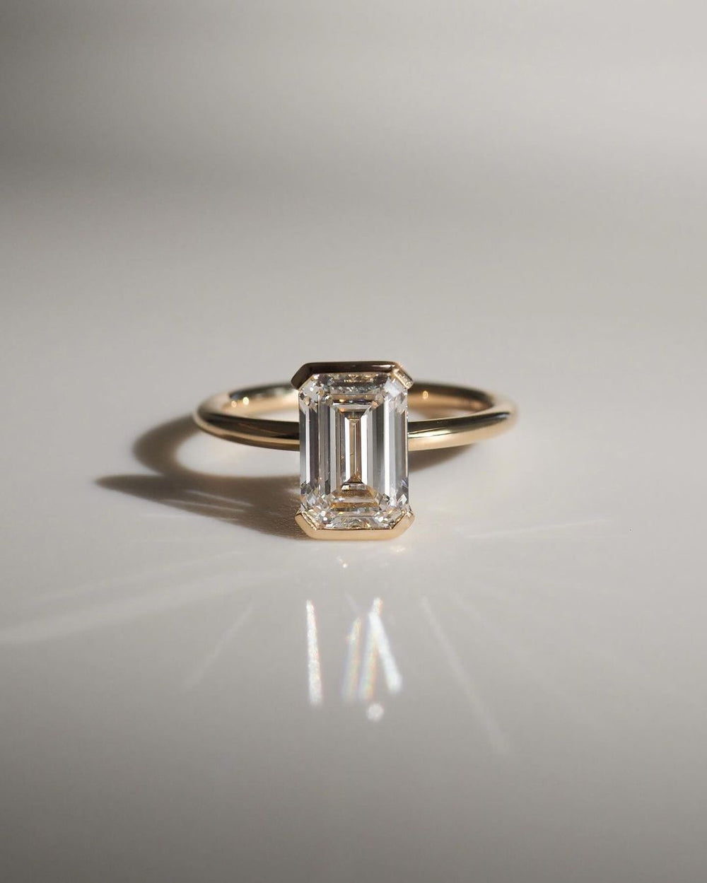 Bezel Set Emerald Cut Labgrown Engagement Ring
