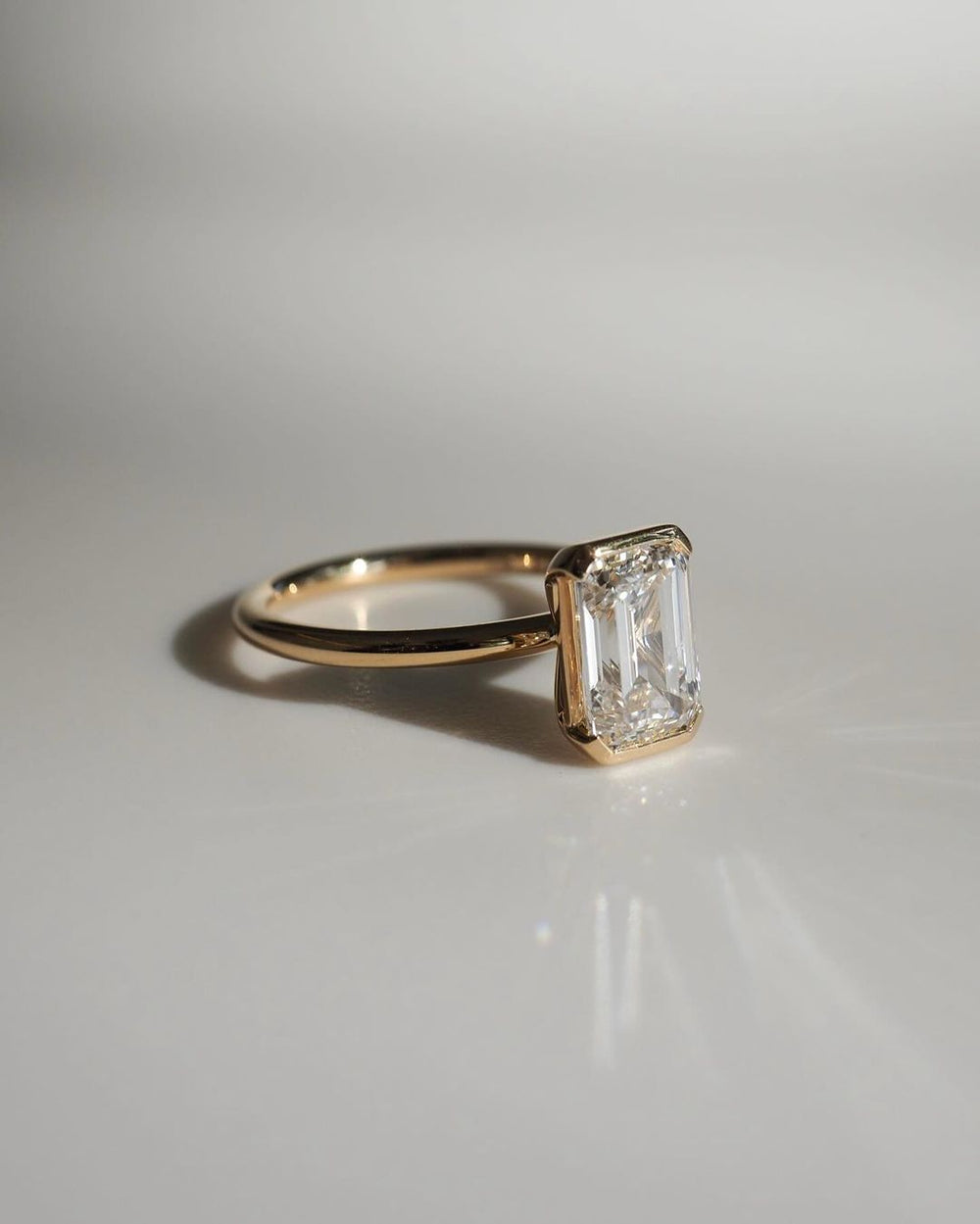 Bezel Set Emerald Cut Labgrown Engagement Ring