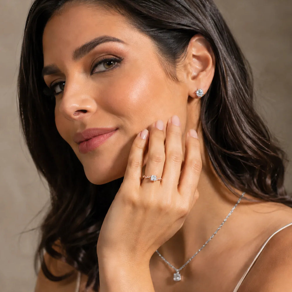 Twisted Side Stone Round Diamond Engagement Ring