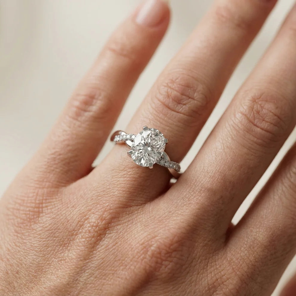 Twisted Side Stone Round Diamond Engagement Ring