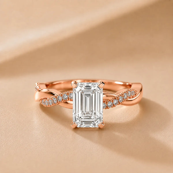 Twisted Side Stone Emerald Diamond Engagement Ring