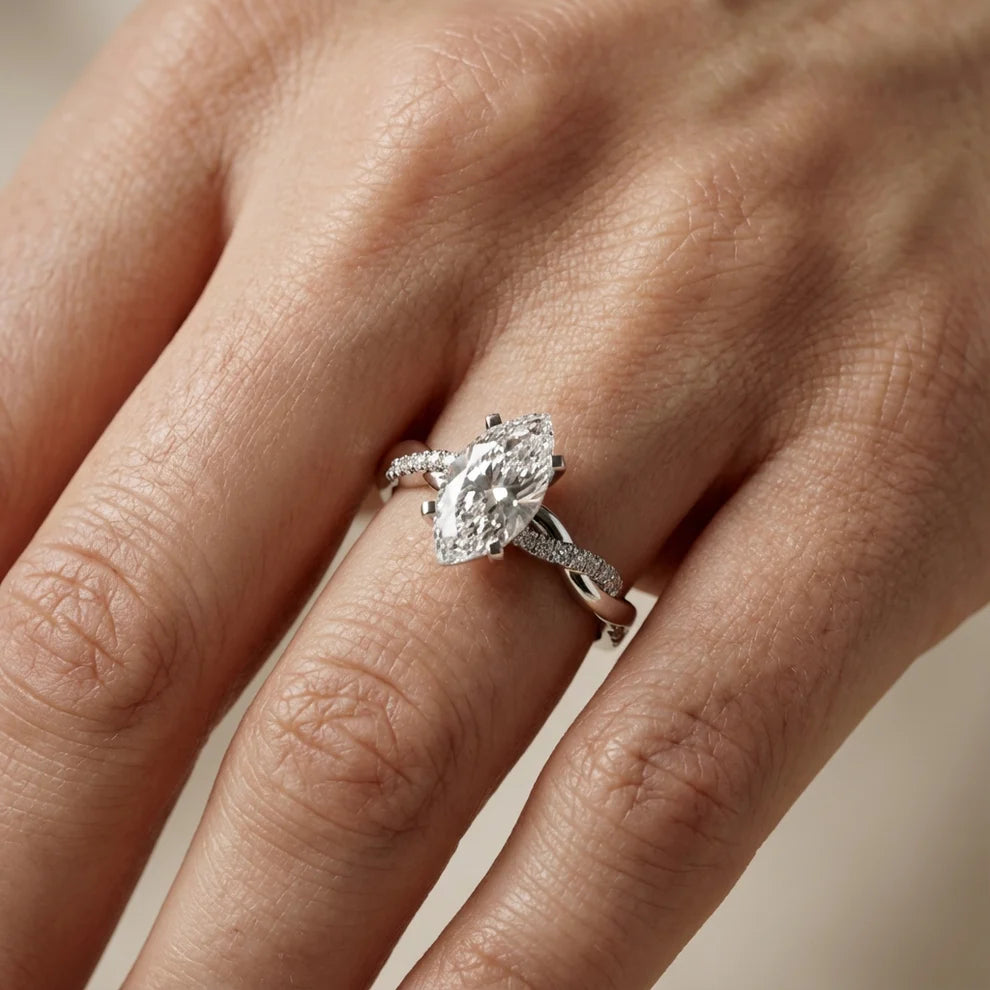 Twisted Side Stone Round Diamond Engagement Ring