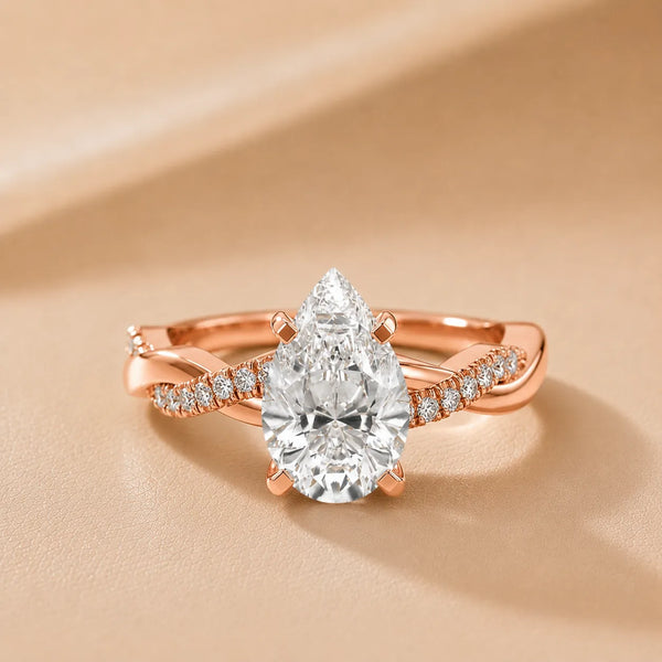 Twisted Side Stone Pear Diamond Engagement Ring