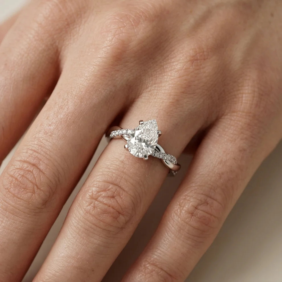 Twisted Side Stone Round Diamond Engagement Ring