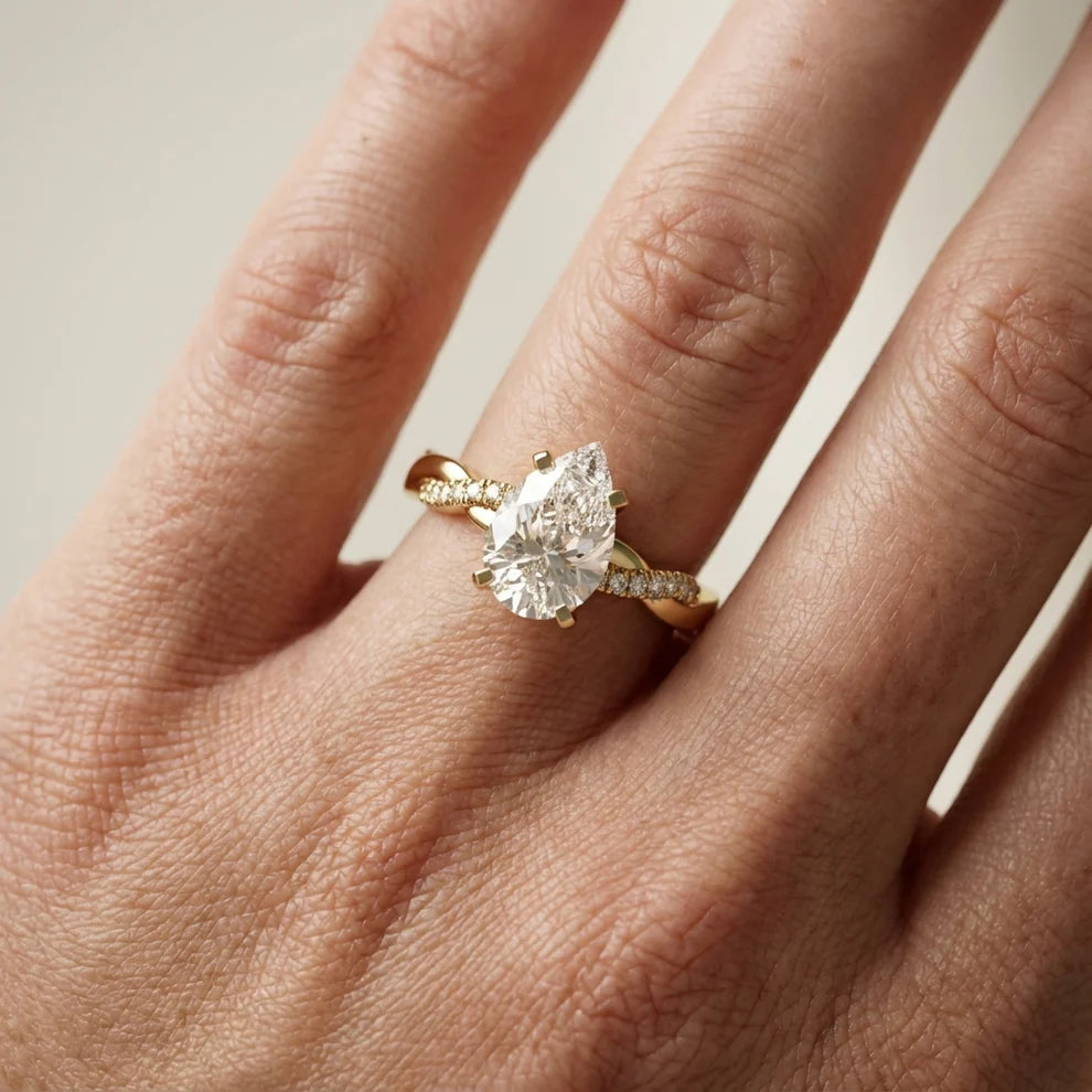 Twisted Side Stone Round Diamond Engagement Ring